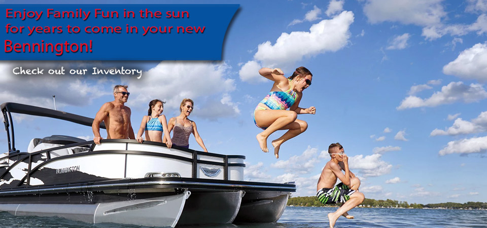 Kids jumping off the bow of a Bennington Pontoon as parents watch